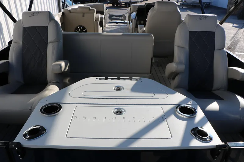 Slide: The Image of 2023 Silver Wave 2410 SW5 RLP boat interior with seating and table setup. - 26