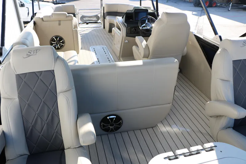 Slide: The Image of 2023 Silver Wave 2410 SW5 RLP boat interior with luxurious seating and modern dashboard. - 28