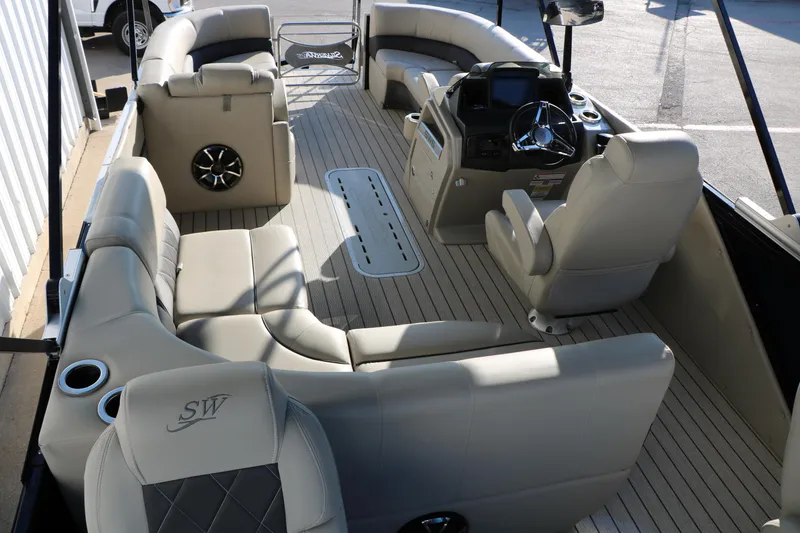 Slide: The Image of 2023 Silver Wave 2410 SW5 RLP pontoon boat interior with luxurious seating and modern helm. - 31