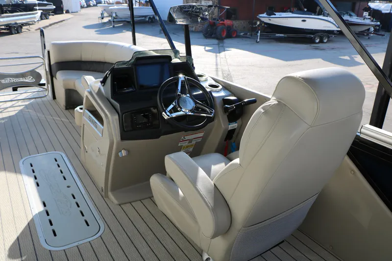 Slide: The Image of 2023 Silver Wave 2410 SW5 RLP boat interior with steering console and seating. - 33