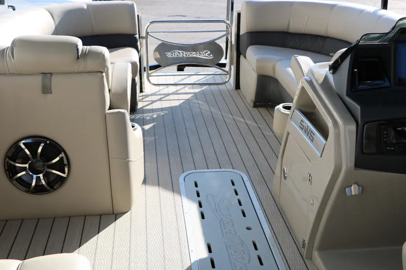 Slide: The Image of Interior of 2023 Silver Wave 2410 SW5 RLP pontoon boat with luxurious seating and modern design. - 35
