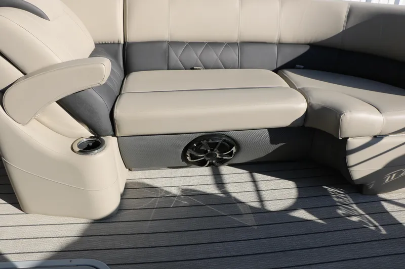Slide: The Image of 2023 Silver Wave 2410 SW5 RLP boat interior with cushioned seating and built-in speaker. - 40