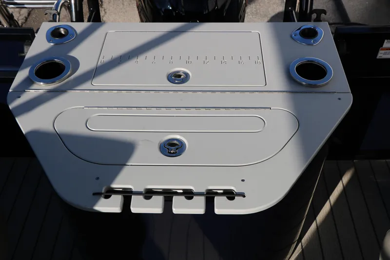 Slide: The Image of 2023 Silver Wave 2410 SW5 RLP boat console with cup holders and storage compartments. - 45