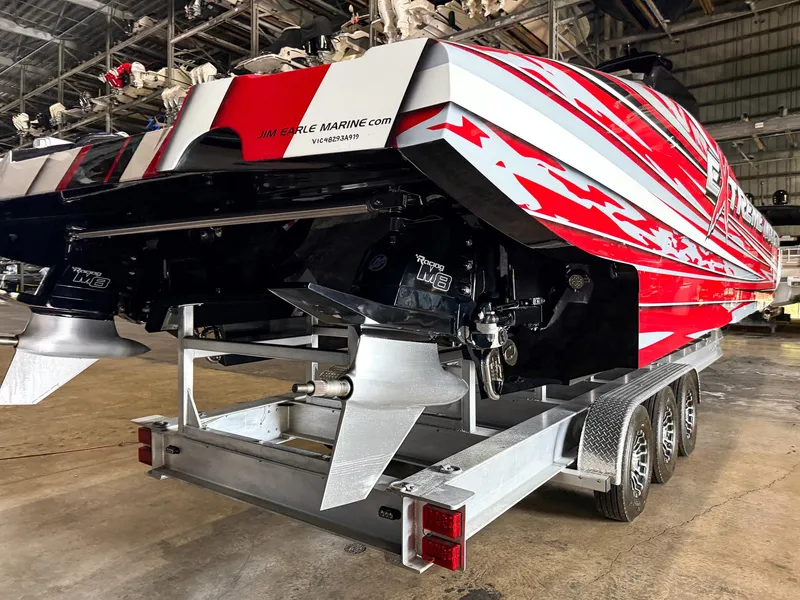 Slide: The Image of Red and white MTI 48 speedboat on trailer in warehouse, 2019 model. - 17