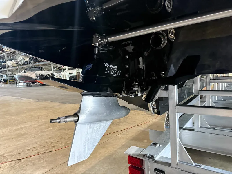 Slide: The Image of Close-up of a 2019 MTI 48 boat's propeller and engine in a storage facility. - 19