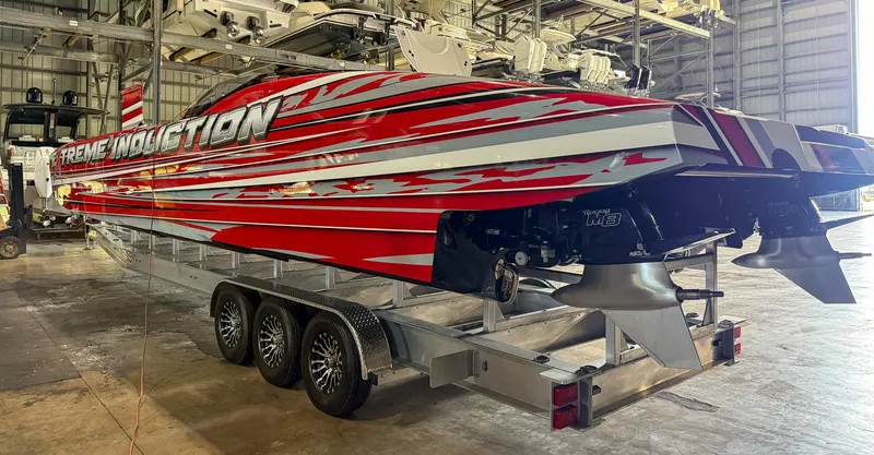 Slide: The Image of Red MTI 48 speedboat on trailer in warehouse, 2019 model. - 20