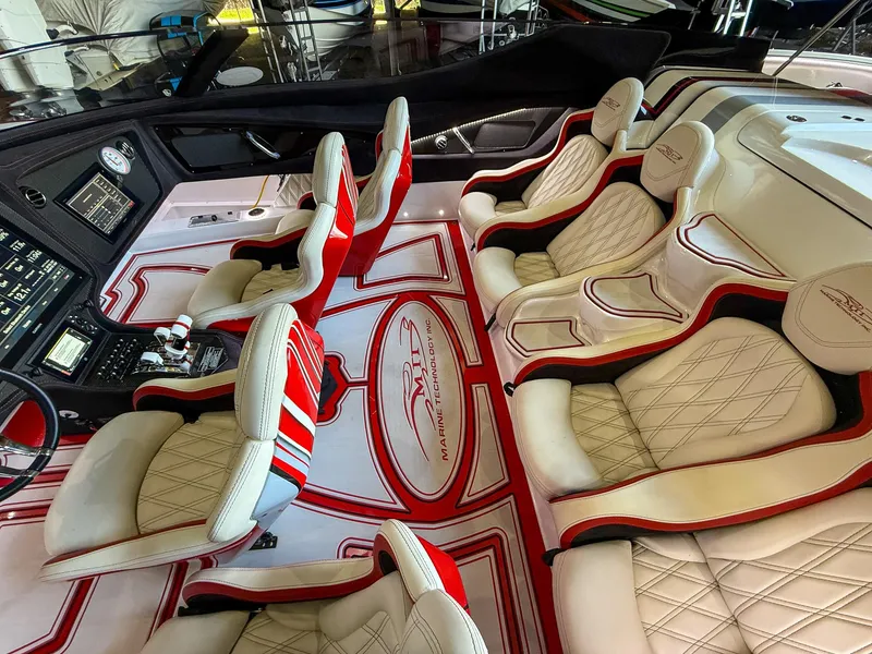 Slide: The Image of Luxurious interior of a 2019 MTI 48 boat with custom white and red seating. - 35