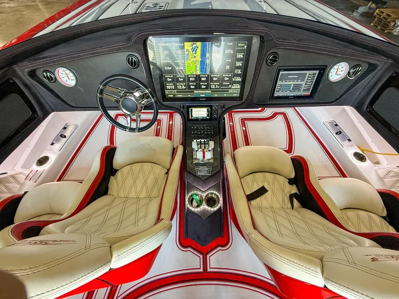 Slide: The Image of Luxurious 2019 MTI 48 boat interior with advanced dashboard and plush seating. - 36