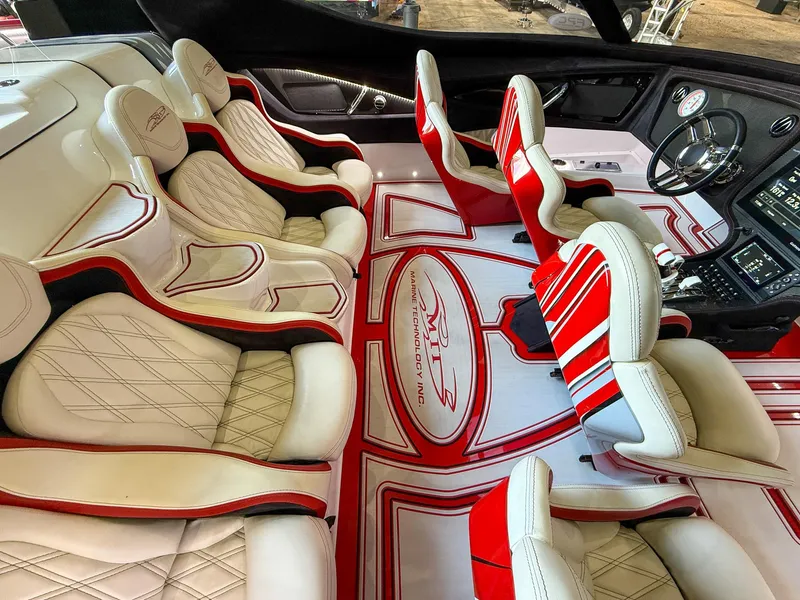Slide: The Image of Luxurious MTI 48 boat interior with red and white seating, 2019 model. - 38