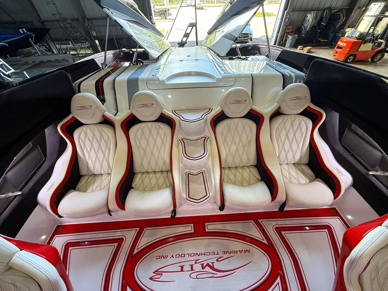 Slide: The Image of Luxurious interior of a 2019 MTI 48 boat with white and red seating. - 39