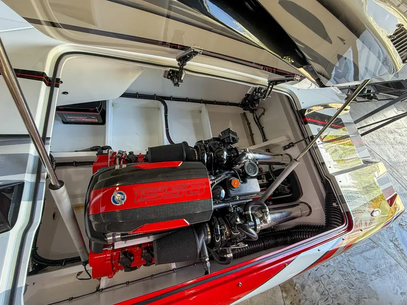 Slide: The Image of High-performance engine in a 2019 MTI 48 boat, featuring a striking red and black design. - 40