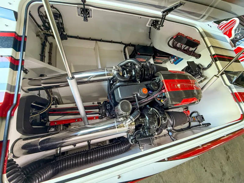 Slide: The Image of Engine compartment of a 2019 MTI 48 boat, showcasing detailed mechanical components. - 43