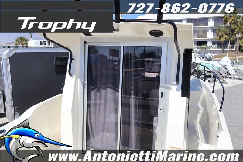 Slide: The Image of 2026 Bayliner Trophy T25 Pilothouse boat at Antonietti Marine dealership. - 11