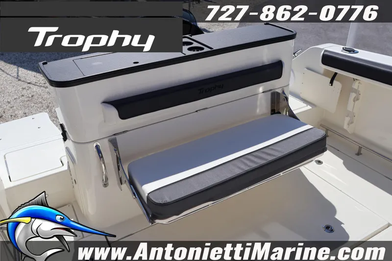 Slide: The Image of 2026 Bayliner Trophy T25 Pilothouse boat seating area with contact details and logo. - 13