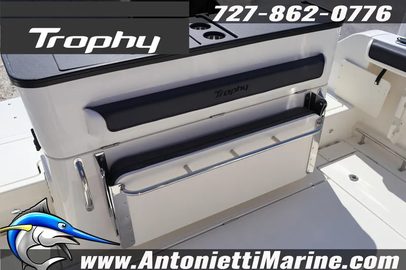 Slide: The Image of 2026 Bayliner Trophy T25 Pilothouse boat interior with seating and storage. - 15