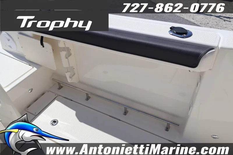 Slide: The Image of 2026 Bayliner Trophy T25 Pilothouse interior with seating and storage features. - 16