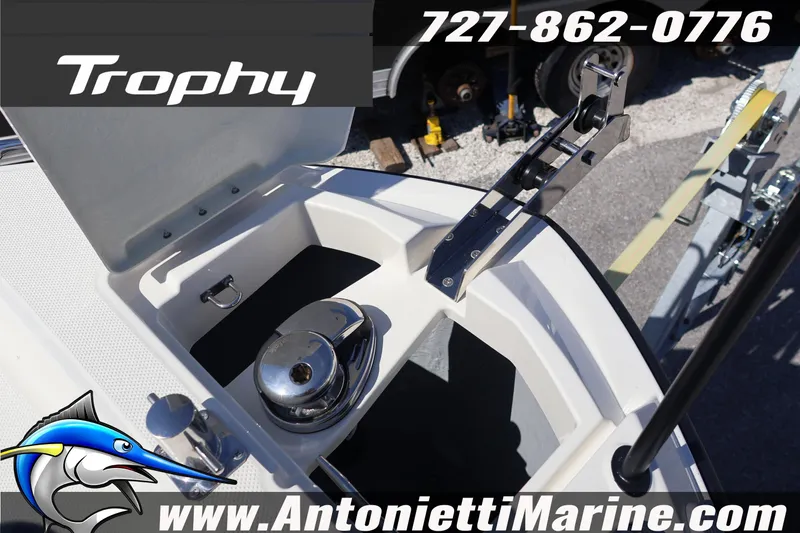 Slide: The Image of 2026 Bayliner Trophy T25 Pilothouse anchor compartment with winch, Antonietti Marine branding. - 21