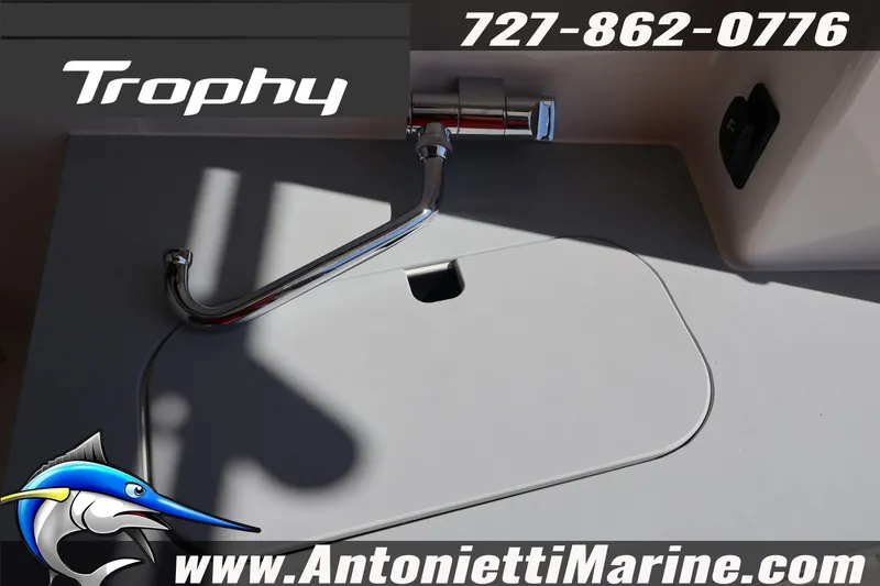 Slide: The Image of 2026 Bayliner Trophy T25 Pilothouse sink area with faucet, Antonietti Marine branding. - 26