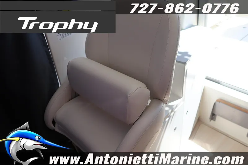 Slide: The Image of 2026 Bayliner Trophy T25 Pilothouse interior seat with contact details and logo. - 34