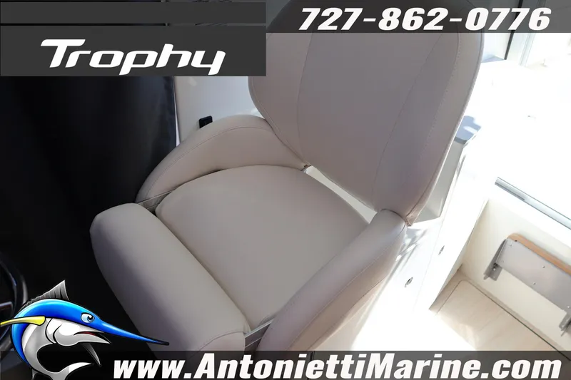 Slide: The Image of 2026 Bayliner Trophy T25 Pilothouse interior seat, Antonietti Marine contact details. - 35