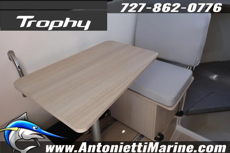 Slide: The Image of Interior of 2026 Bayliner Trophy T25 Pilothouse with seating and table. - 39