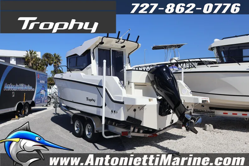 Slide: The Image of 2026 Bayliner Trophy T25 Pilothouse boat on trailer at Antonietti Marine dealership. - 4