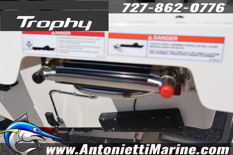 Slide: The Image of Bayliner Trophy T25 Pilothouse 2026 boat detail with contact information and logo. - 6