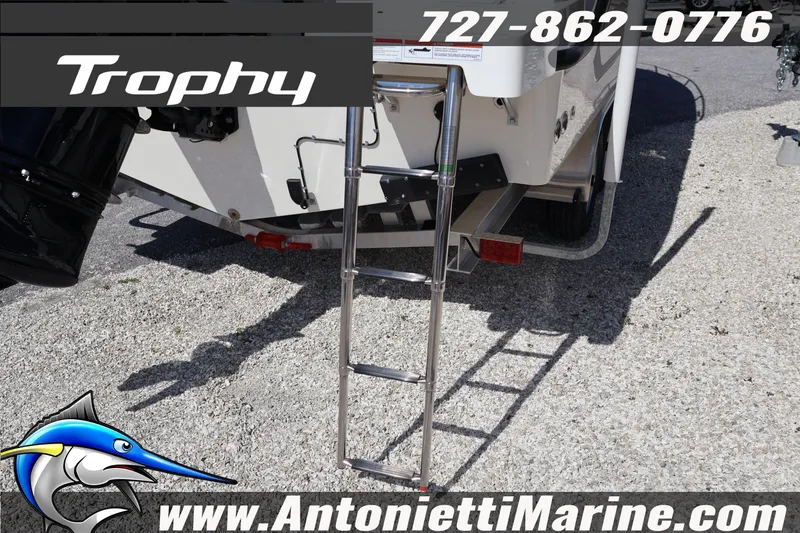 Slide: The Image of Bayliner Trophy T25 Pilothouse 2026 boat with ladder, contact info, and website displayed. - 7