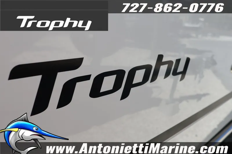 Slide: The Image of Bayliner Trophy T25 Pilothouse 2026 logo with contact details and marlin graphic. - 9