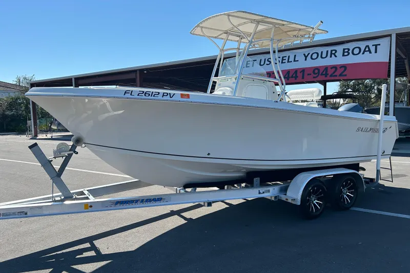 Slide: The Image of 2015 Sailfish 220 CC boat on trailer in parking lot, sunny day. - 5