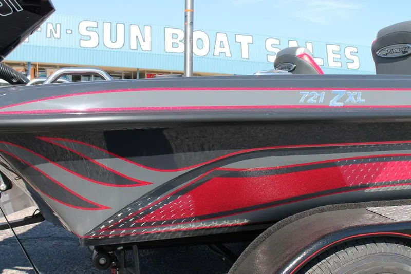 Slide: The Image of 2025 Phoenix 721 ZXL boat with red and gray design at Sun Boat Sales. - 10