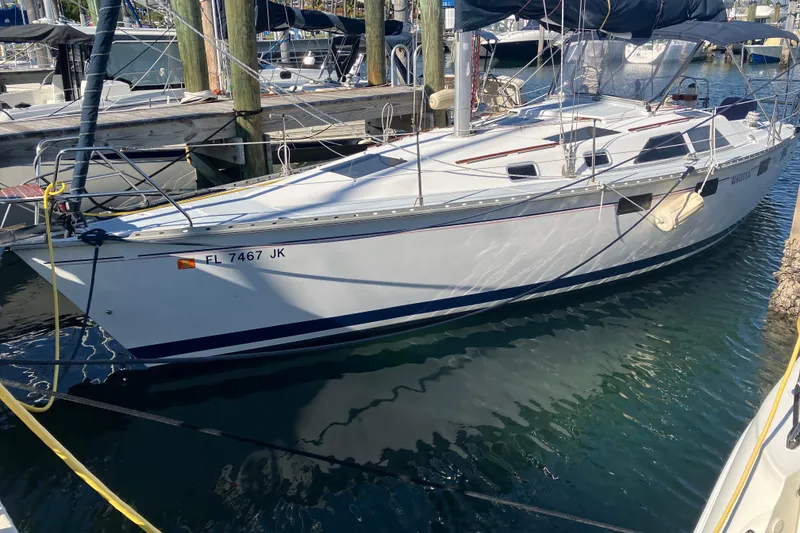 The Image of 1995 Hunter Legend 35.5 sailboat docked in marina, side view. - 1