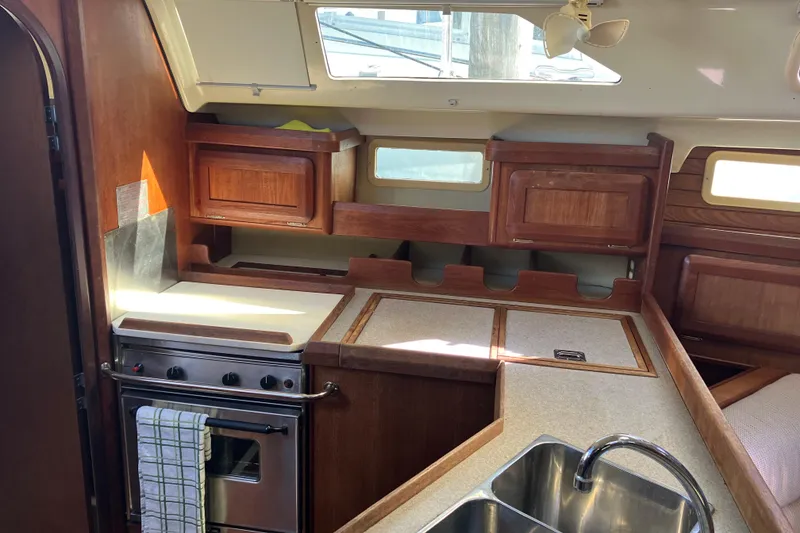 Slide: The Image of Interior of 1995 Hunter Legend 35.5 sailboat kitchen with stove and sink. - 11