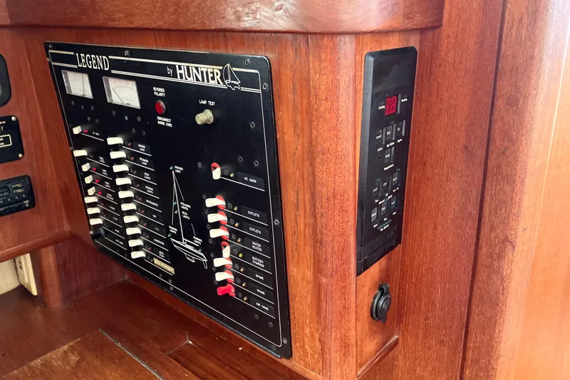 Slide: The Image of Control panel of a 1995 Hunter Legend 35.5 sailboat with wooden finish. - 14