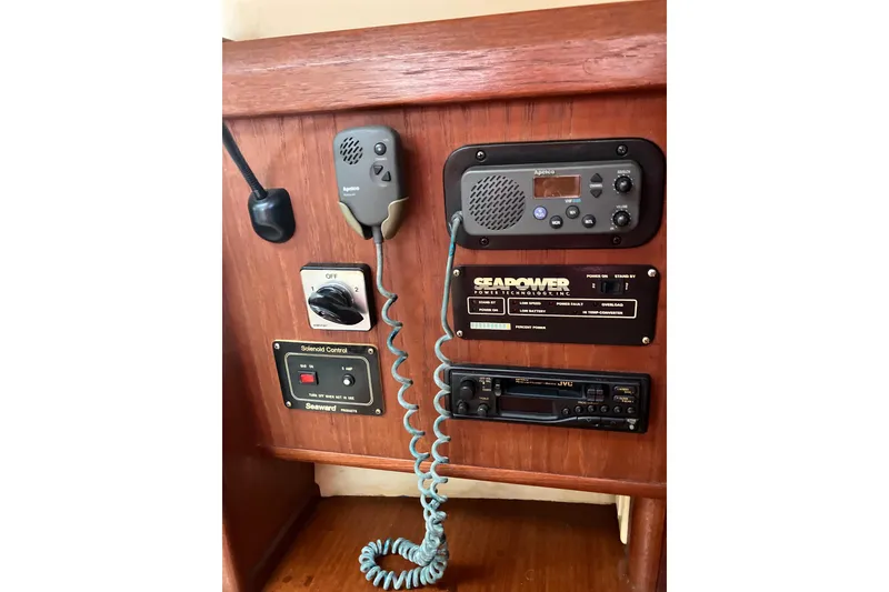 Slide: The Image of Control panel of a 1995 Hunter Legend 35.5 sailboat with communication equipment. - 15