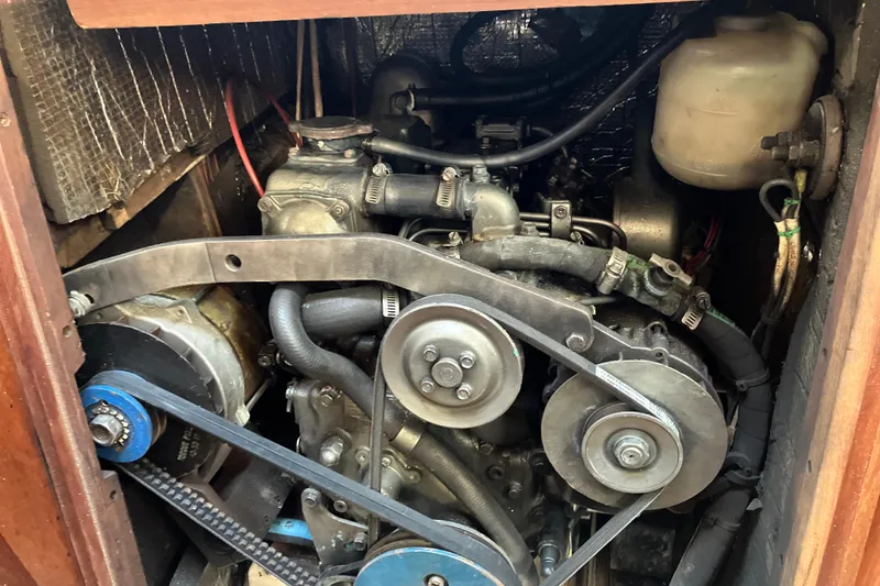 Slide: The Image of Engine compartment of a 1995 Hunter Legend 35.5 sailboat, showing belts and hoses. - 17