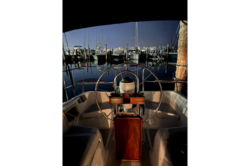 Slide: The Image of Cockpit view of 1995 Hunter Legend 35.5 sailboat at marina during twilight. - 6