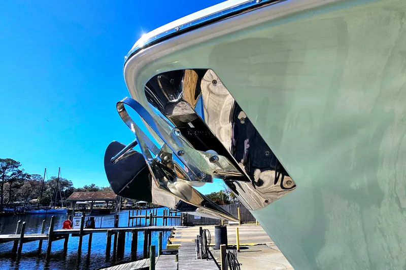 Slide: The Image of 2026 Sea Hunt Ultra 285 SE boat anchor detail against clear blue sky. - 10