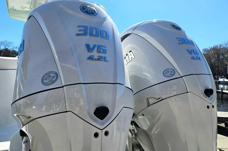 Slide: The Image of Twin Yamaha 300 V6 4.2L outboard engines on a 2026 Sea Hunt Ultra 285 SE boat. - 11