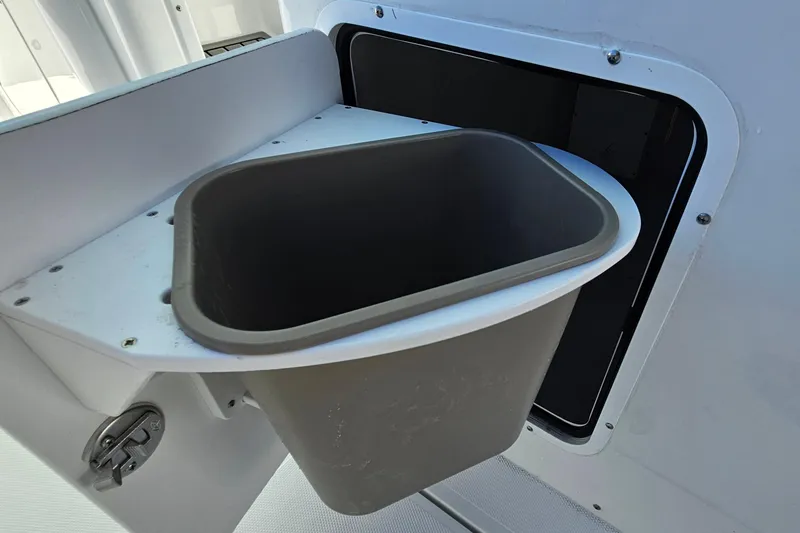 Slide: The Image of Built-in trash bin on 2026 Sea Hunt Ultra 285 SE boat. - 18