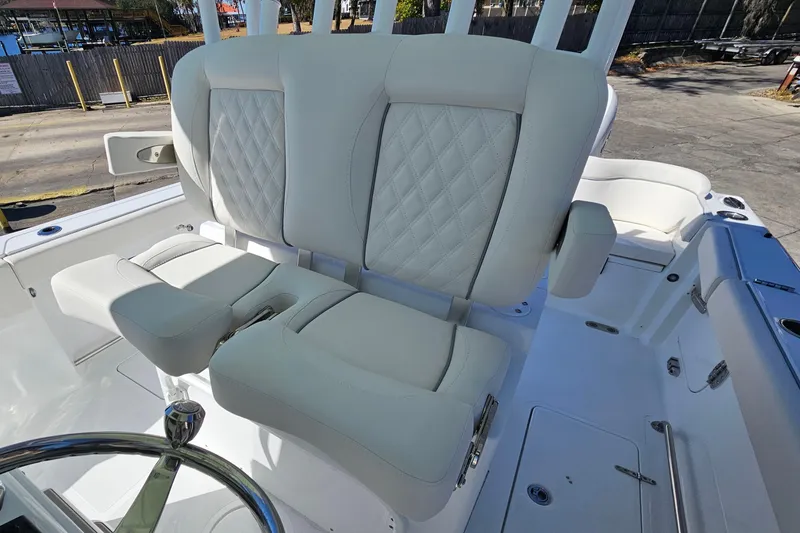 Slide: The Image of Luxurious seating on 2026 Sea Hunt Ultra 285 SE boat, featuring diamond-stitched upholstery. - 19