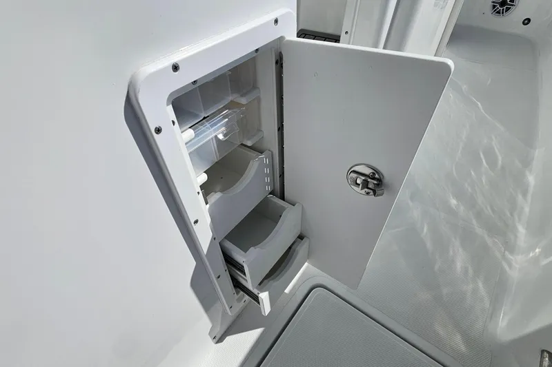 Slide: The Image of Open storage compartment on 2026 Sea Hunt Ultra 285 SE boat. - 20
