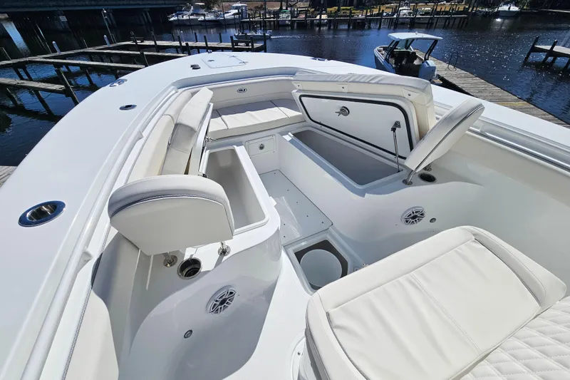 Slide: The Image of 2026 Sea Hunt Ultra 285 SE boat interior with open storage compartments and seating. - 28