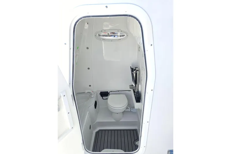 Slide: The Image of Interior view of 2026 Sea Hunt Ultra 285 SE boat bathroom. - 29