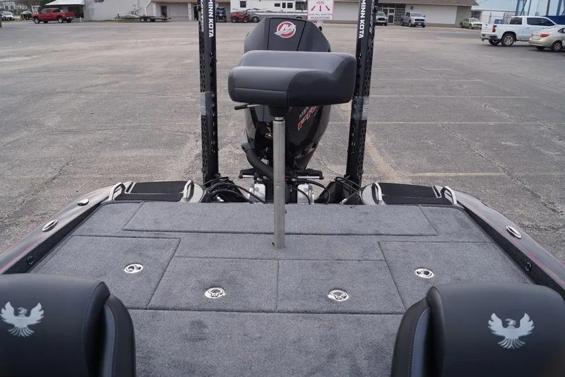 Slide: The Image of 2026 Phoenix 721 ZXL boat deck with seating and motor in a parking lot. - 11