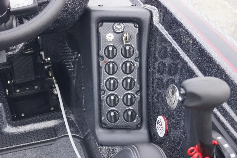 Slide: The Image of Control panel of 2026 Phoenix 721 ZXL boat with switches and steering wheel. - 15