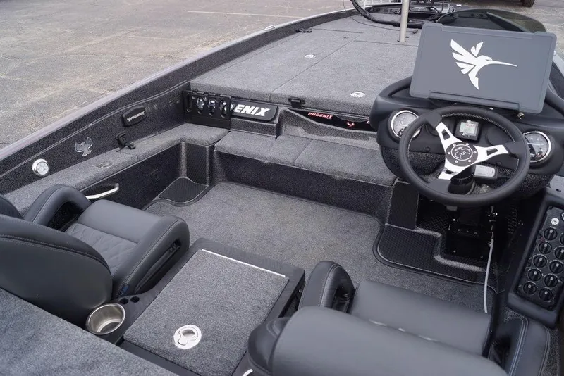 Slide: The Image of Interior of 2026 Phoenix 721 ZXL boat with modern steering and seating. - 16