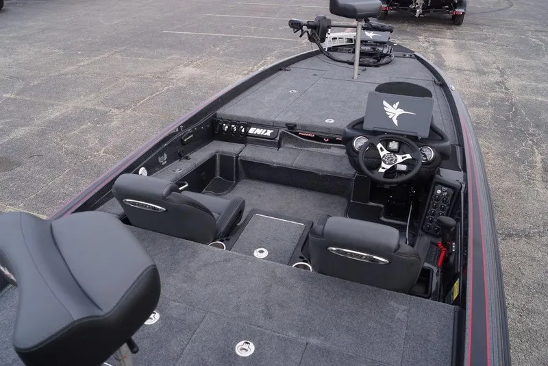 Slide: The Image of 2026 Phoenix 721 ZXL boat interior with steering wheel and seating. - 17