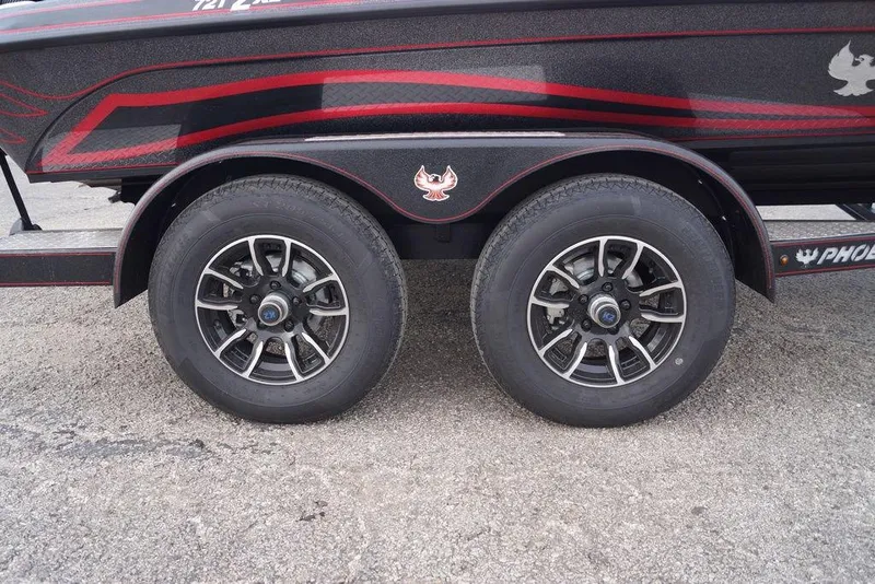 Slide: The Image of 2026 Phoenix 721 ZXL trailer with dual wheels and stylish red accents. - 4