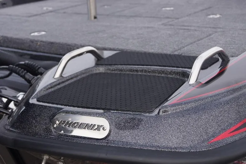 Slide: The Image of 2026 Phoenix 721 ZXL boat deck with handles and logo detail. - 7